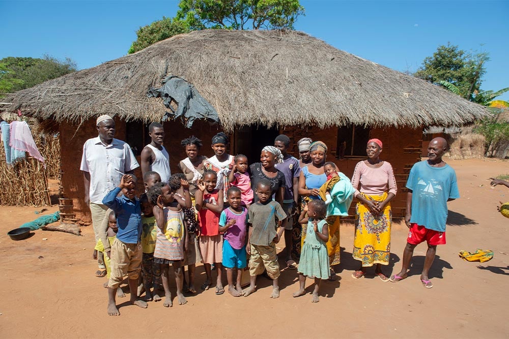 Anabela smiling with Zena and their family before her cleft surgery