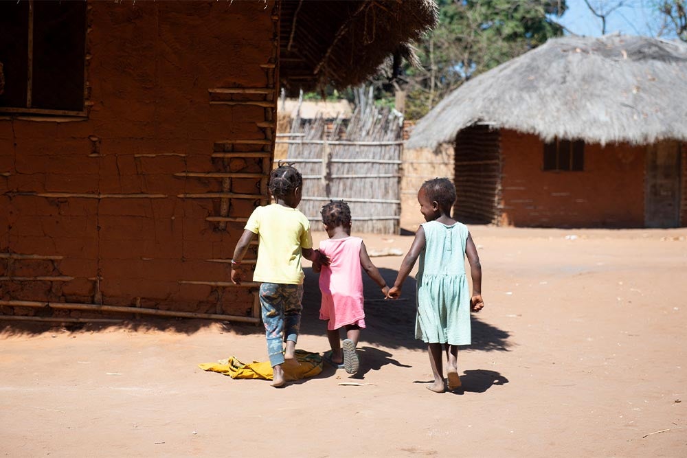 Zena walking with her friends before cleft surgery