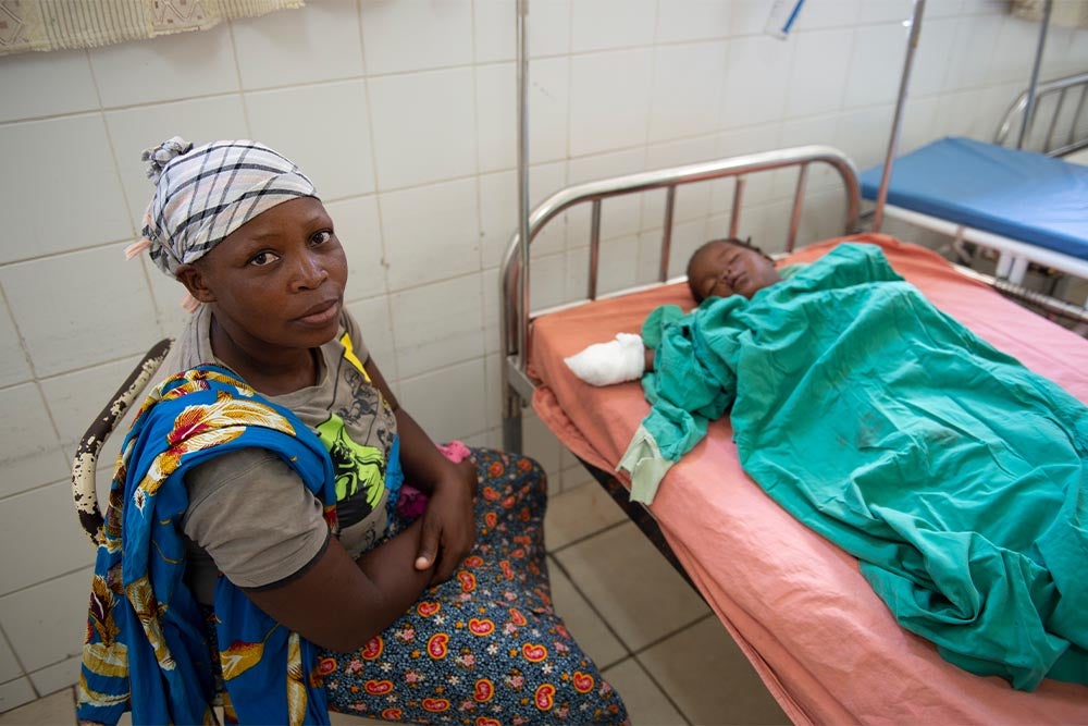 Anabela sitting with Zena after her cleft surgery