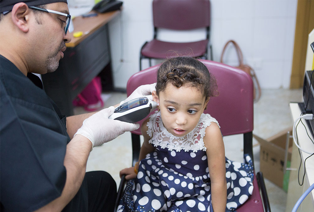 Dr. Tarek testing a cleft-affected patient's hearing
