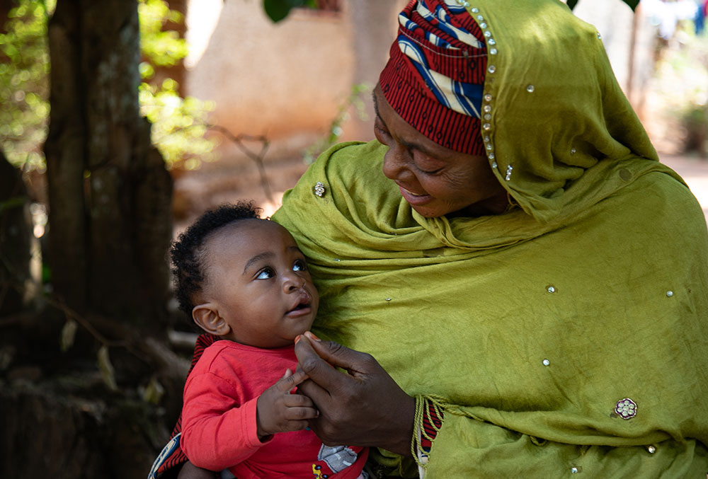 Mouhamed with his grandmother after cleft surgery