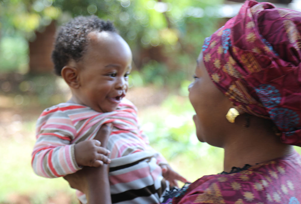 Mouhamed smiling with his mother Rafiatou before cleft surgery