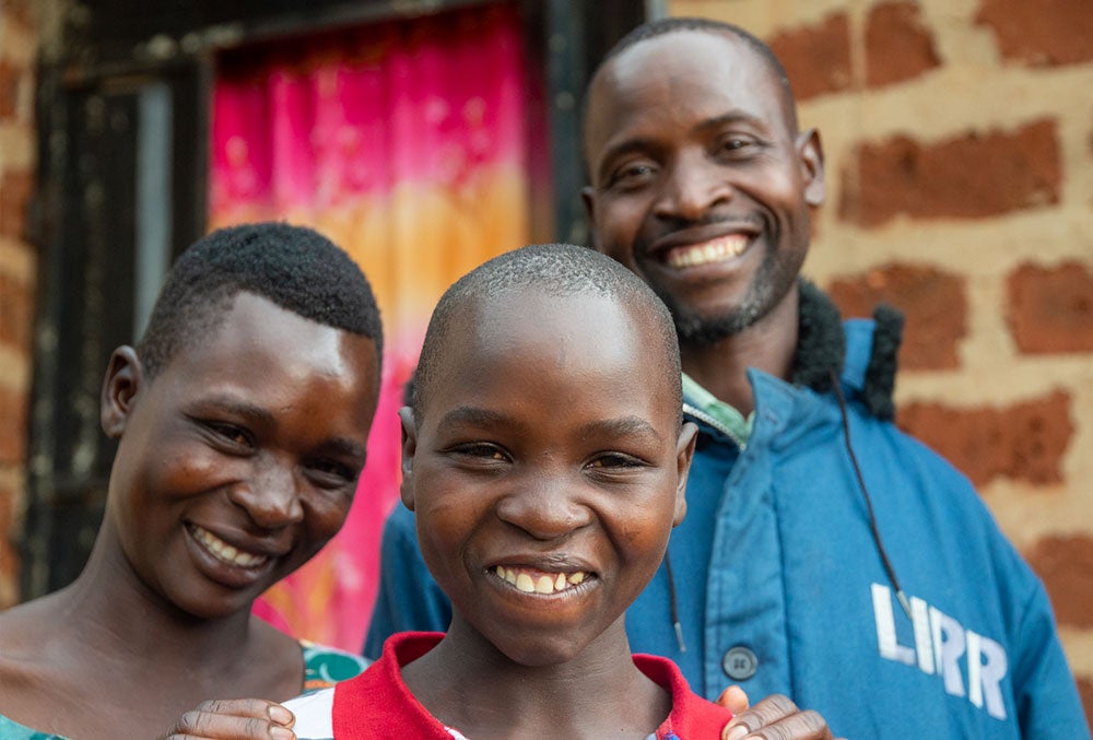 Osawa smiling with his parents after cleft surgery