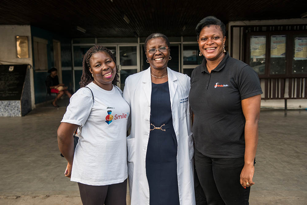 Professor Olugbemiga Ogunlewe smiling with Victoria Awazie and NK Obi