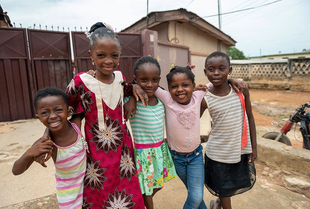 Rawdah smiling with her friends after cleft surgery