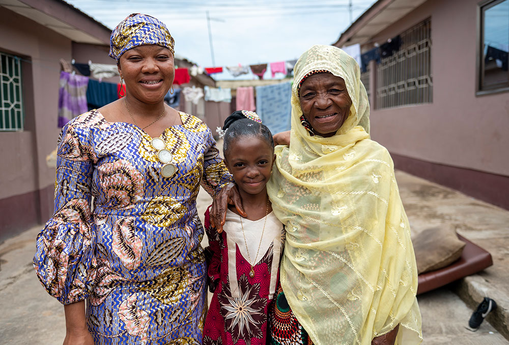 Rawdah smiling with her mother Alimatu and grandmother after cleft surgery