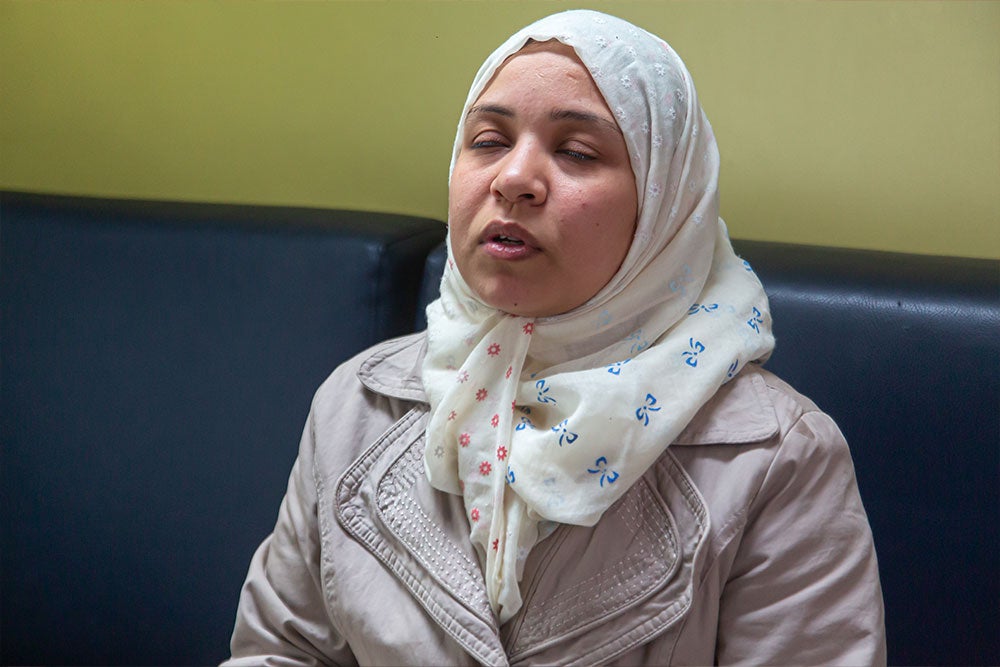 Nagla praying during Mustafa's cleft surgery