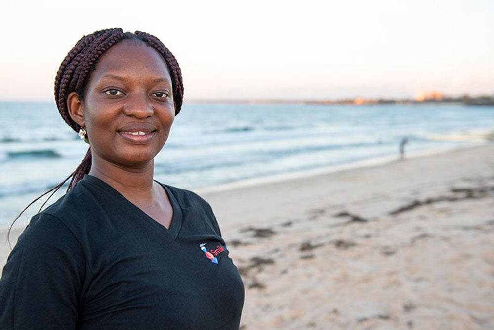 Yona smiling on the beach