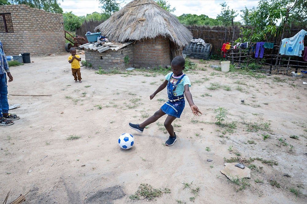Janerose playing with a soccer ball
