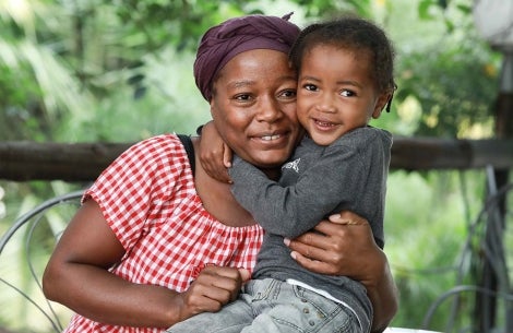 boy happy hugs mom