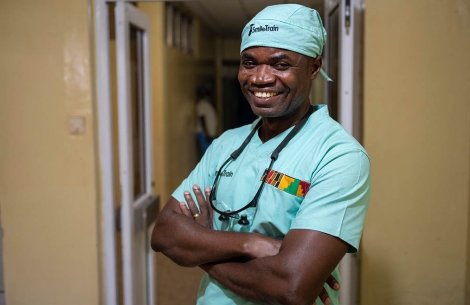 Smile Train surgeon from Ghana smiles in scrubs