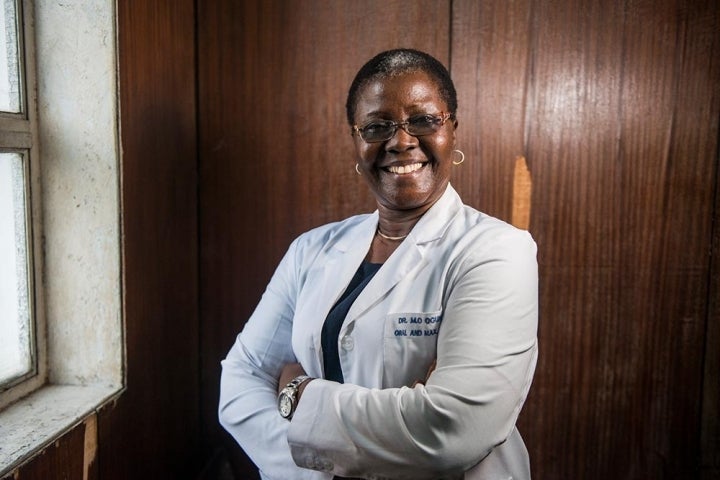 Professor Olugbemiga Ogunlewe smiling with her arms crossed