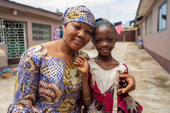 Rawdah smiling with her mother Alimatu after cleft surgery