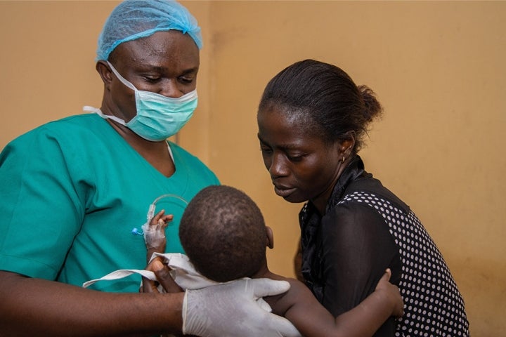 handing over a child after cleft surgery