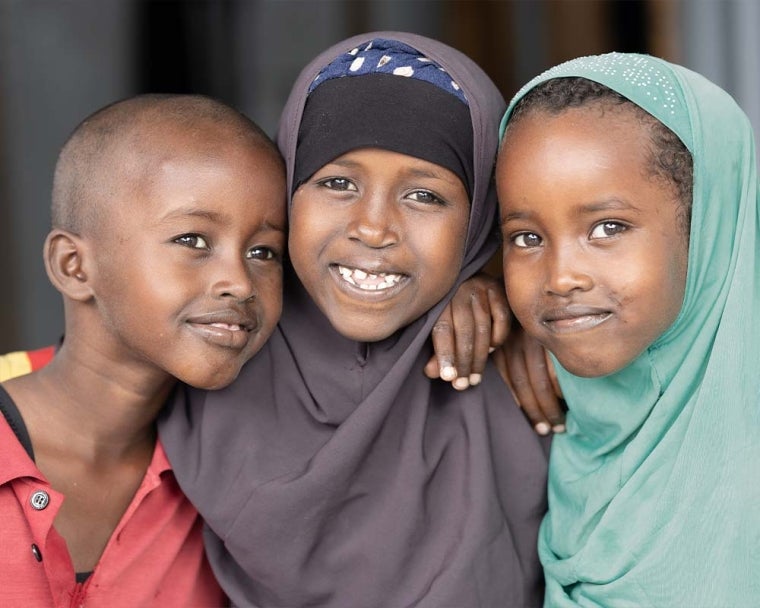 Nasro smiling after cleft surgery with her friends